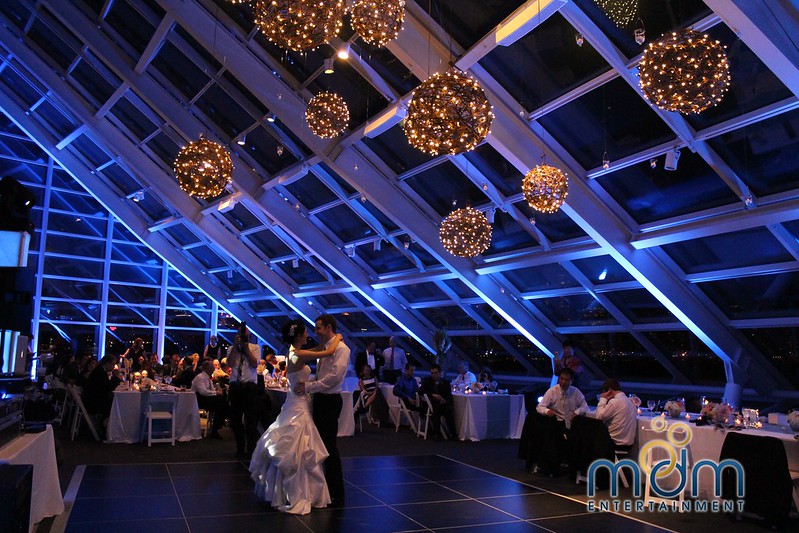 Bride And Groom Dancing Under The Grapevine Balls Chandeliers At Solarium