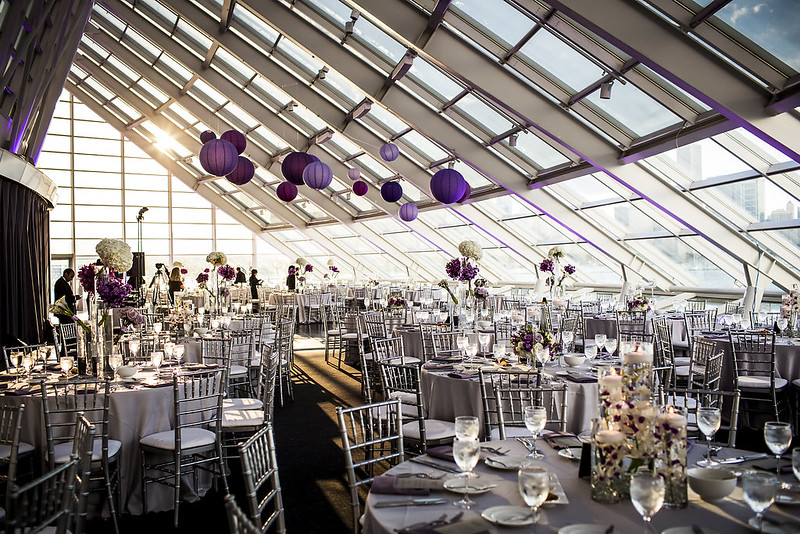 Tables And Chairs With Hanging Purple Paper Lanterns Above