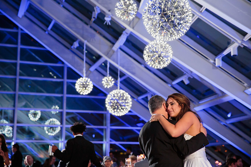 Bride And Groom Under The Modern Chandeliers