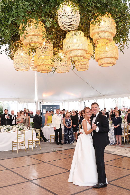 Wedding Guests Watch The Bride And Groom Smiling Happily Under The Rattan Lanterns Wedding Decor