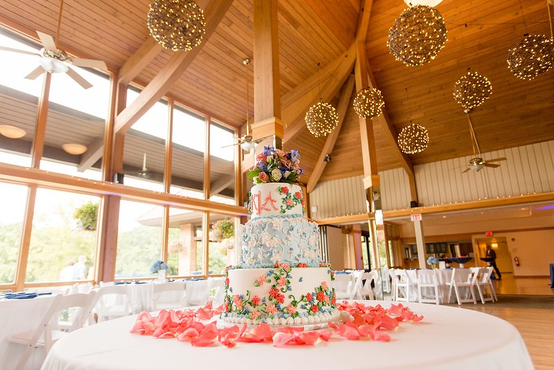 Three Layer Wedding Cake Under Grapevine Chandeliers