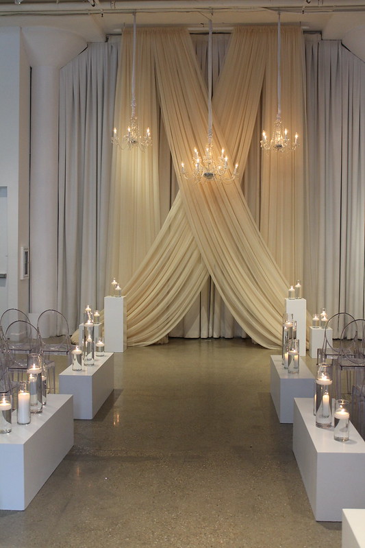 Wedding Chandeliers As A Backdrop With Drape Wall