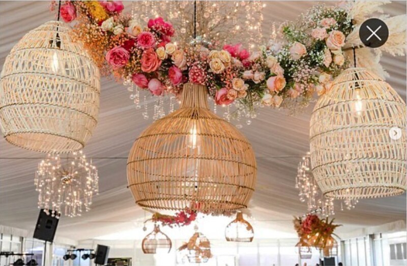 Three Rattan Lanterns Hanging, Different In Styles With Floral Arrangements