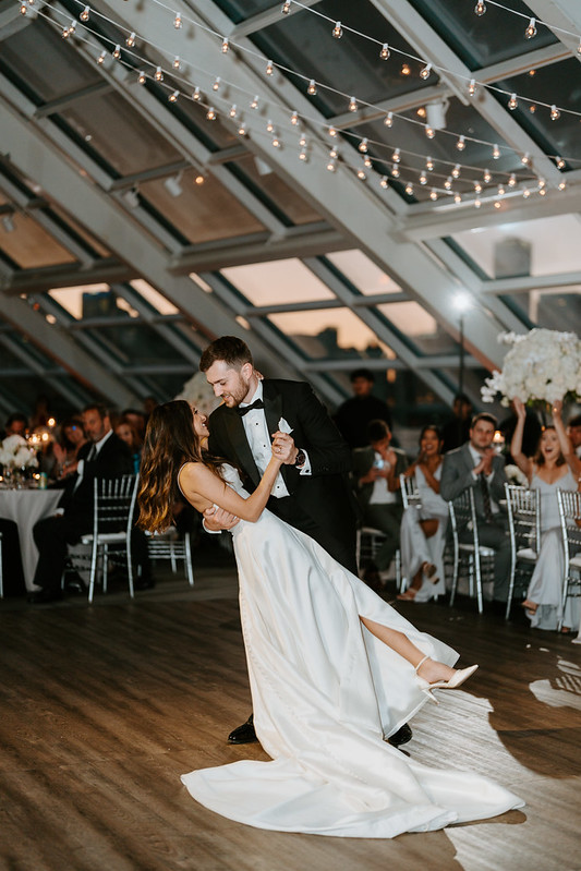 Bride And Groom Dancing Under The String Lights