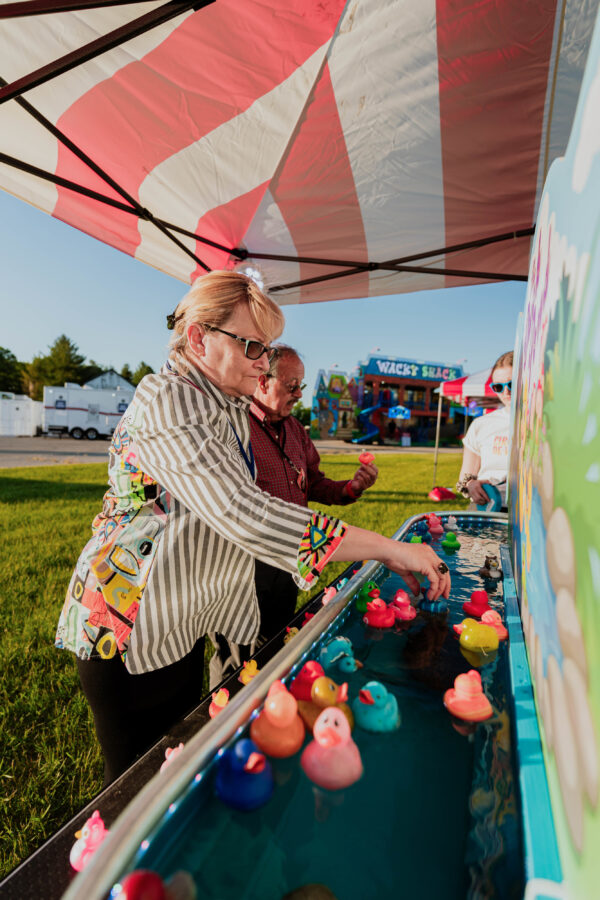 Old Woman Playing Squishy Ducks In Duck Pond Games