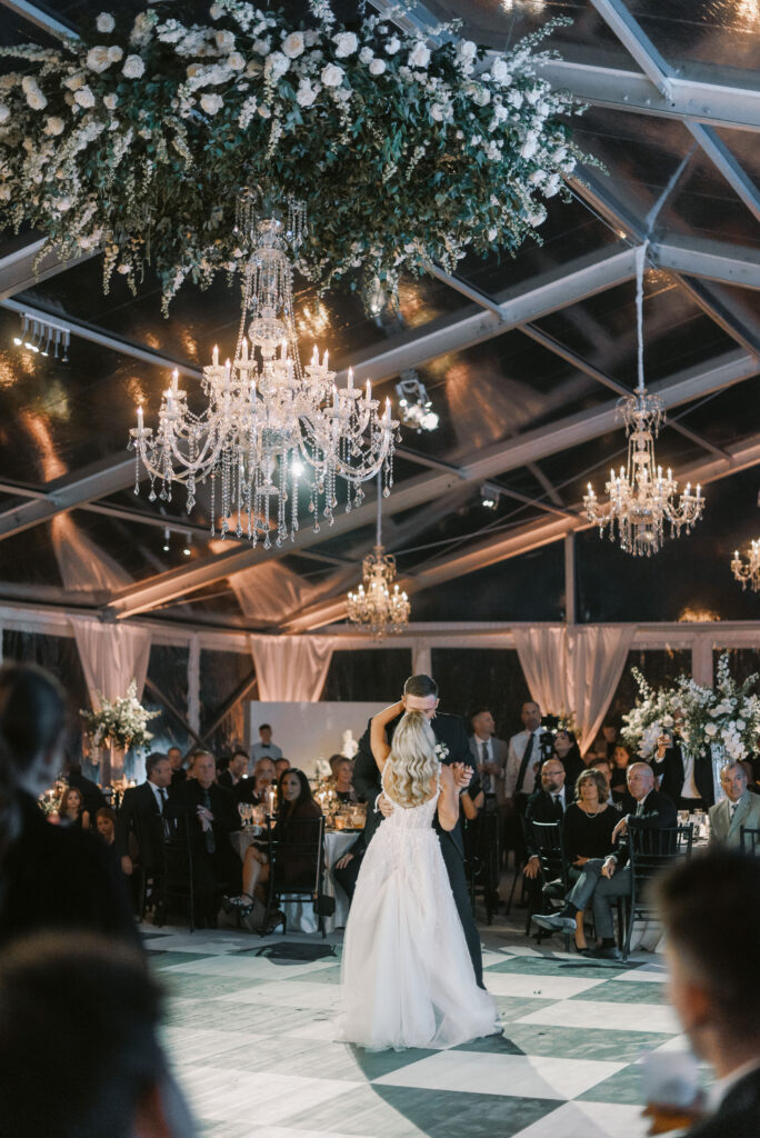 The Clubhouse Wedding First Dance With Chandeliers And Greenery