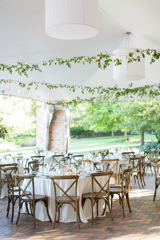 Tent Wedding With String Lights And Greenery
