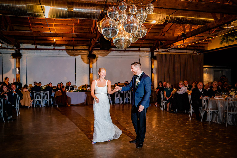 Bride And Groom Under The Clustered Mirror Balls