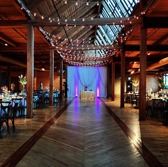 Wedding Loft Venue With Purple Lighting And String Lights