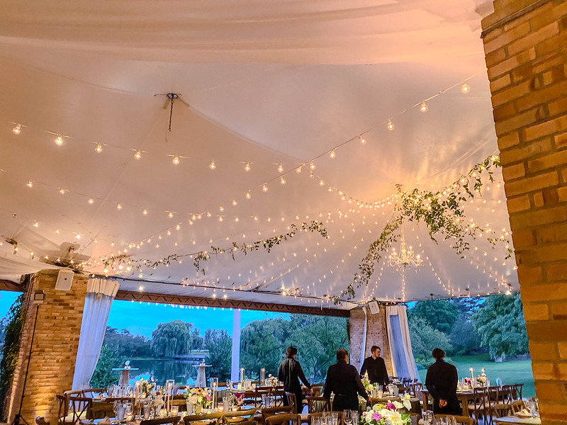 Tent With String Lights And Greenery And Chandelier