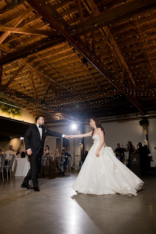 Bride And Groom Dancing Under The Romantic Twinkle Lights