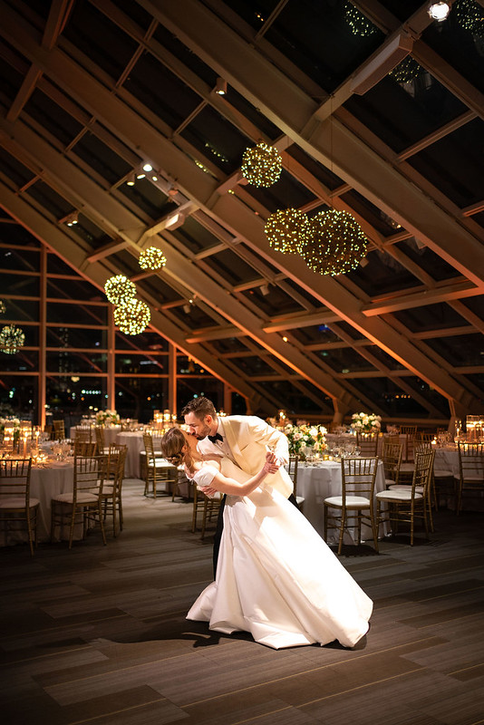 Bride And Groom Dancing At Adler Planetarium. Hanging Grapevine Balls With Lights