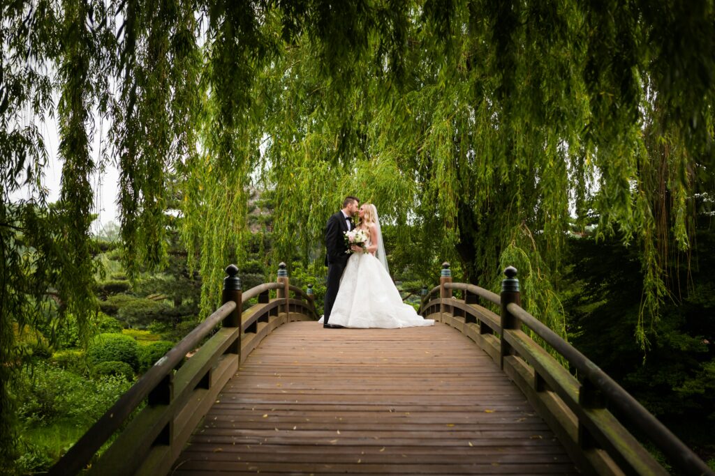 Bride And Groom In The Wooden Bridge