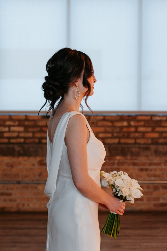 Bride In Her Wedding Dress Holding A Bouquet