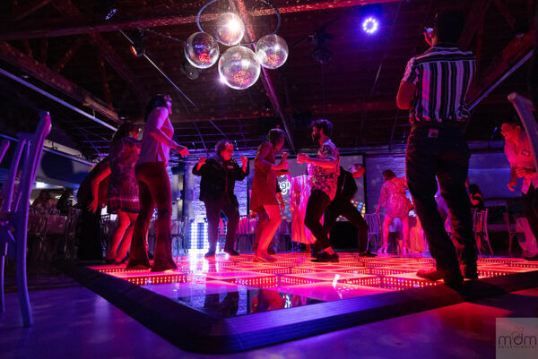 Guests Dancing In The Led Dancefloor, Mirror Balls Hanging Above Them