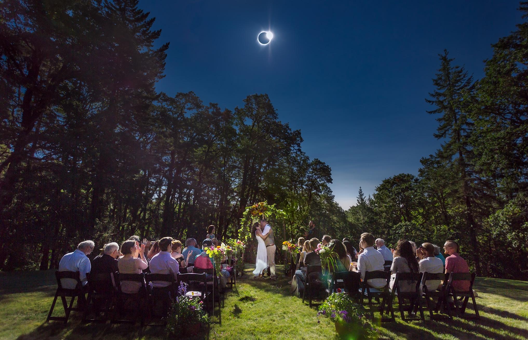 outdoor eclipse wedding reception under the solar eclipse