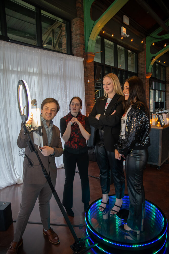 360 Photo Booth Operator Introduce The 360 Photo Booth To Three Women