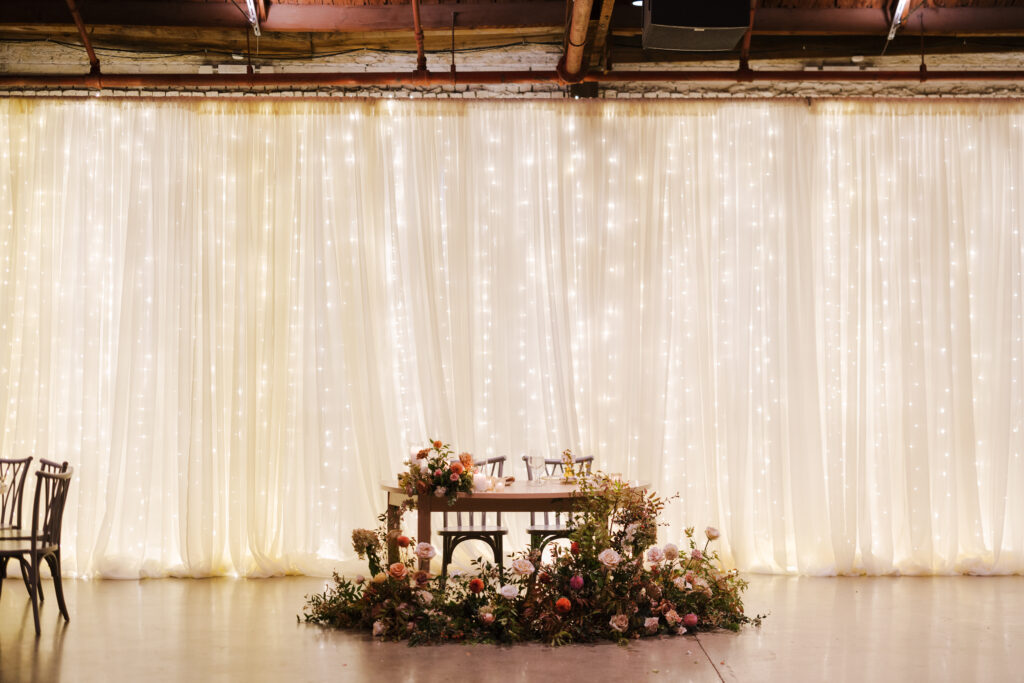 Hannah And Declan'S Wedding Reception With Twinkle Lights Backdrop