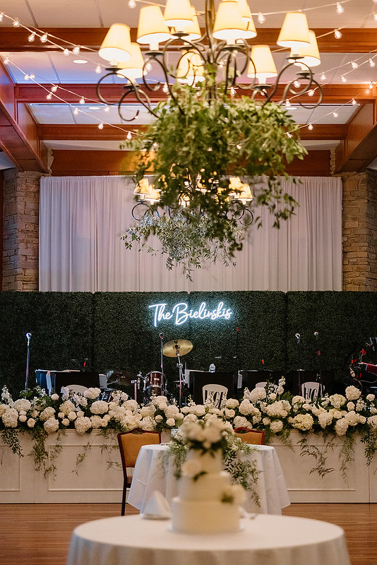 Greenery Wall Rental With White Floral Decor