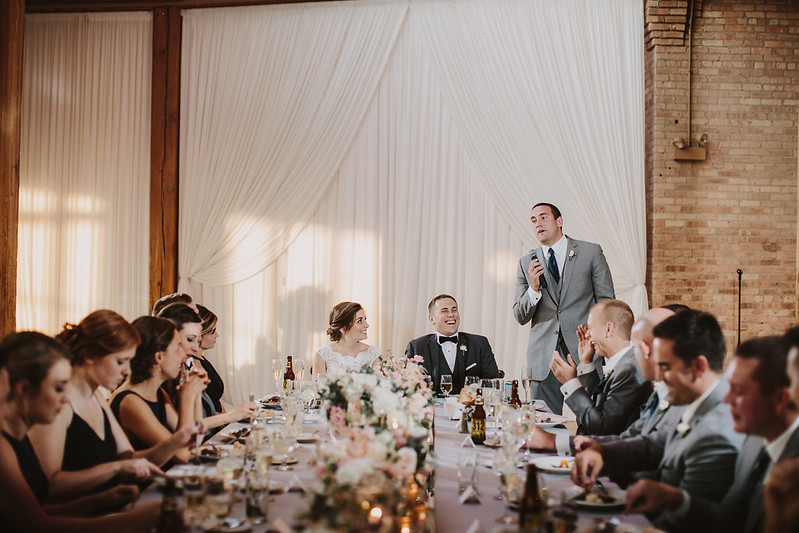 Wedding Guest With White Drape As Their Backdrop