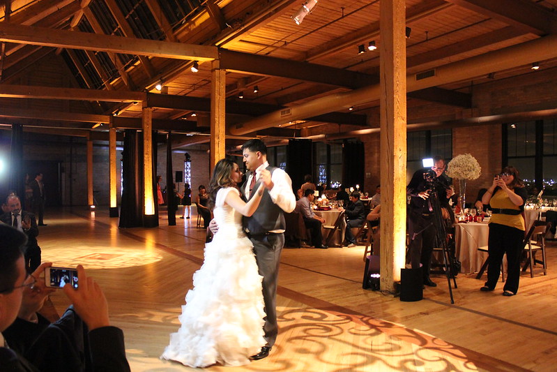 Bride And Groom Dancing Under A Gobo Lighting