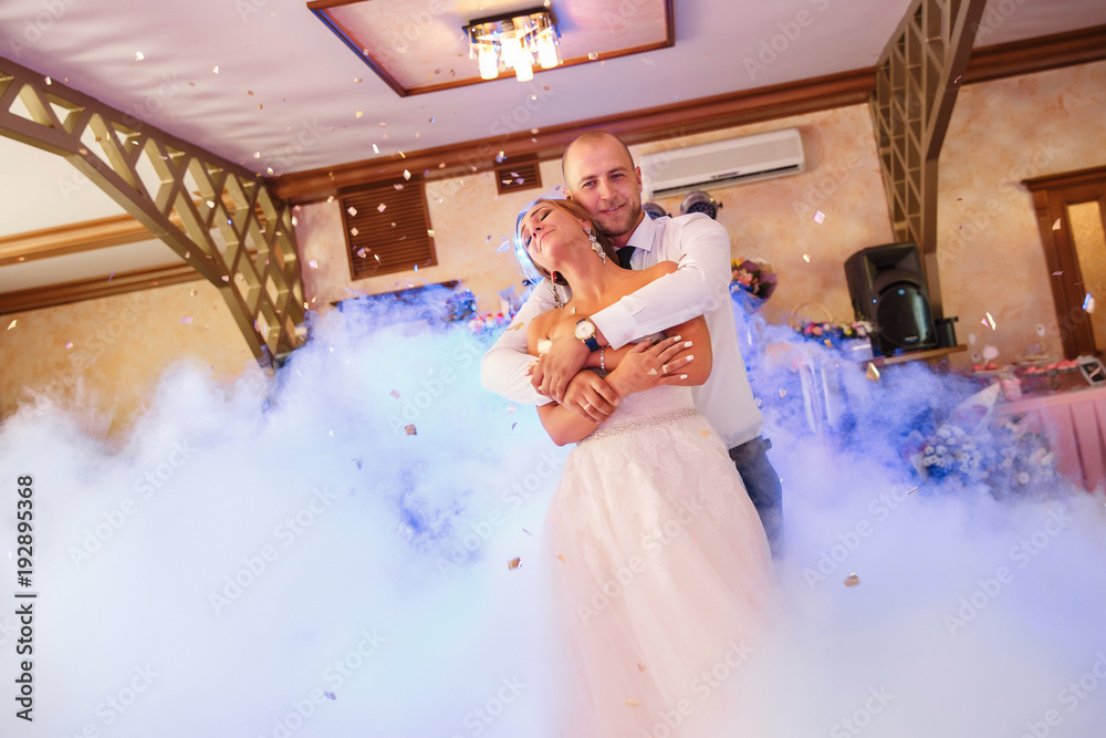 Bride And Groom Dancing On The Clouds