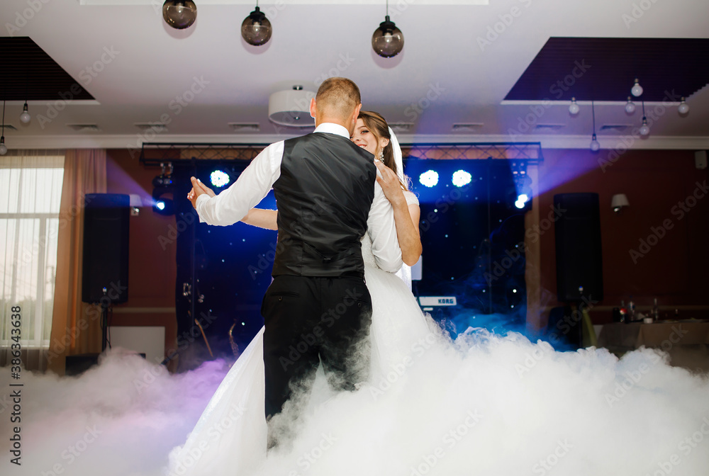 Bride And Groom Dancing On The Clouds