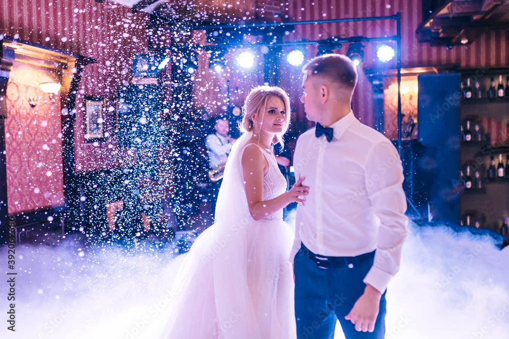 bride and groom dancing in the clouds