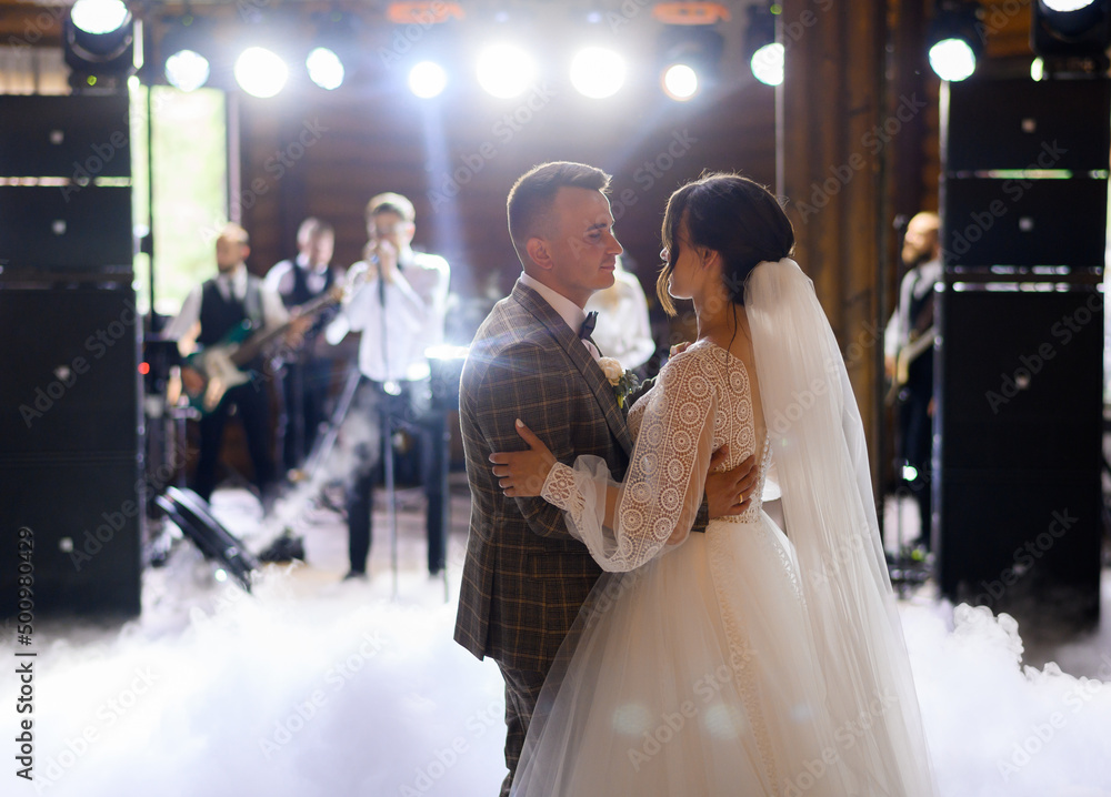 Bride And Groom Dancing On The Clouds