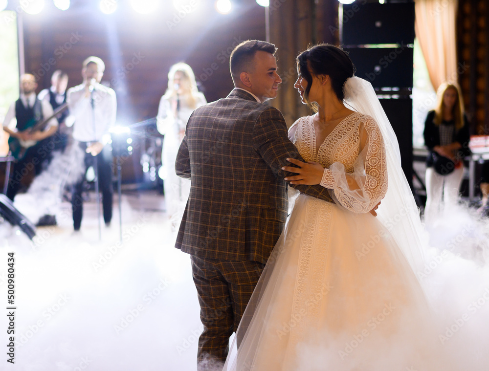 Bride And Groom Dancing On The Clouds