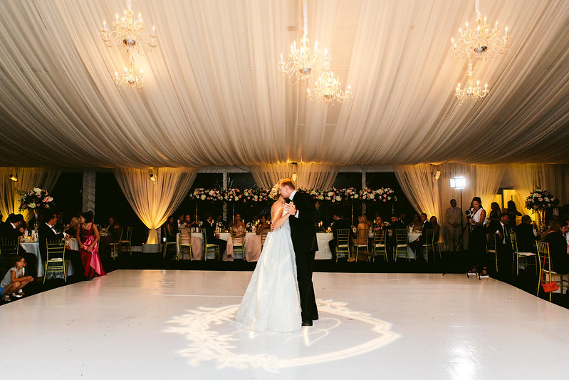 Bride And Groom Dancing Under The Chandeliers, With Uplighting And Wedding Monogram