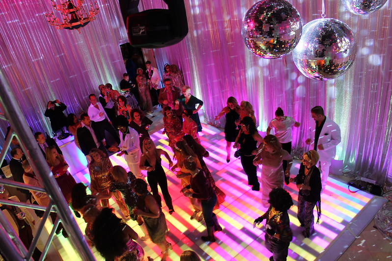 Guests Dance On The Led Dance Floor With Hanging Mirror Balls