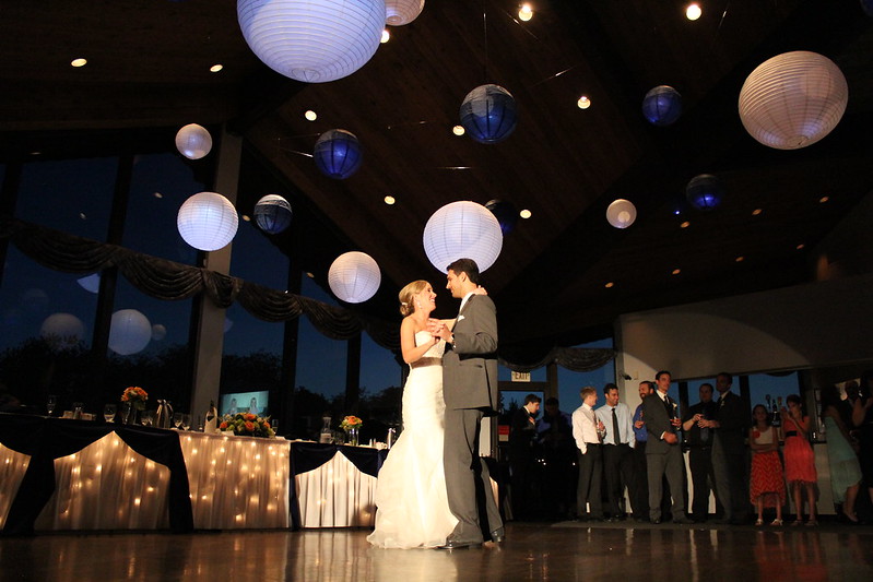 bride and groom dancing under the big paper lanterns