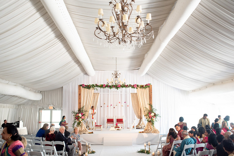 Wedding Canopy With White Drape And Floral Decor