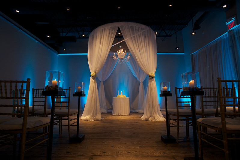 Wedding Canopy Made With White Drape And With Blue Uplighting