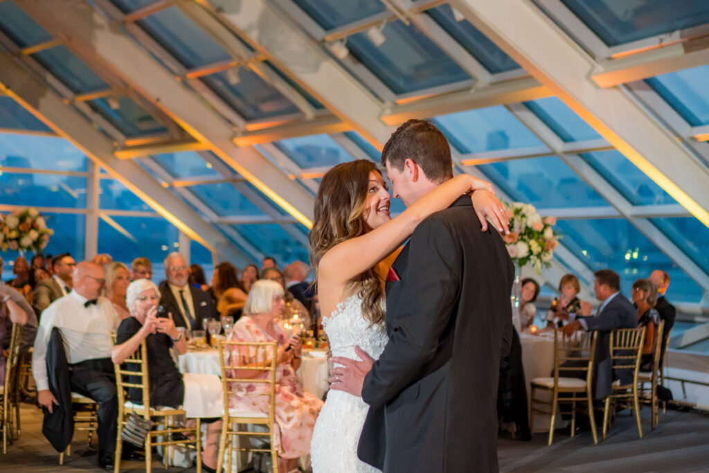 Bride And Groom Dancing Under The Rattan Lanterns At The Reception