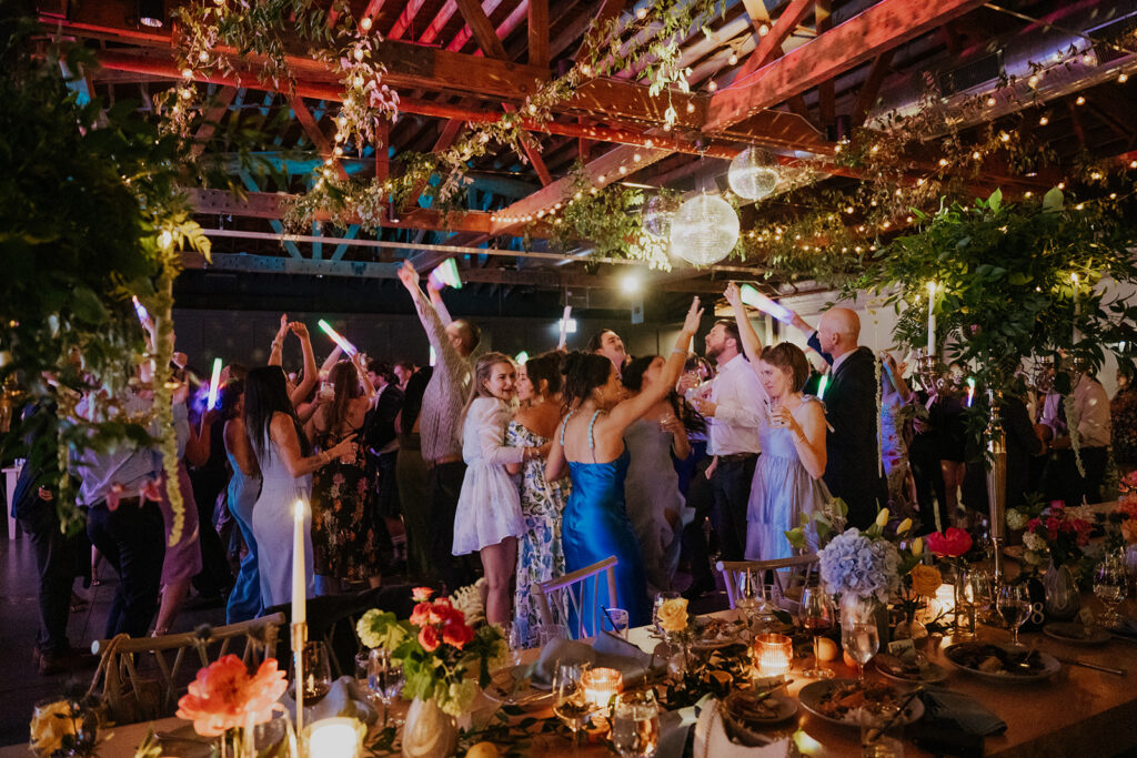 Guests Dancing Under The Mirror Balls And String Lights