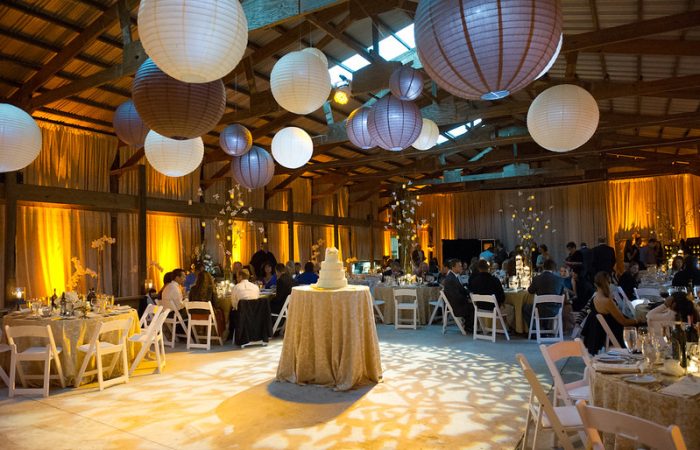 Wedding Reception With Big Paper Lanterns Hanging In The Ceiling