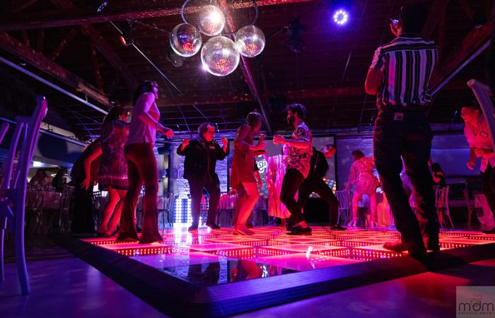 Guests Dance On The Led Dance Floor With Hanging Mirror Balls