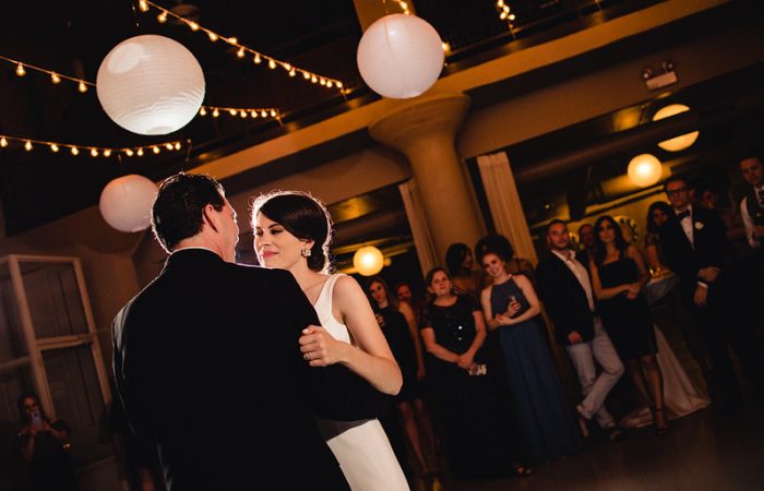 Bride And Groom Under The Wedding Paper Lanterns With Stringlights