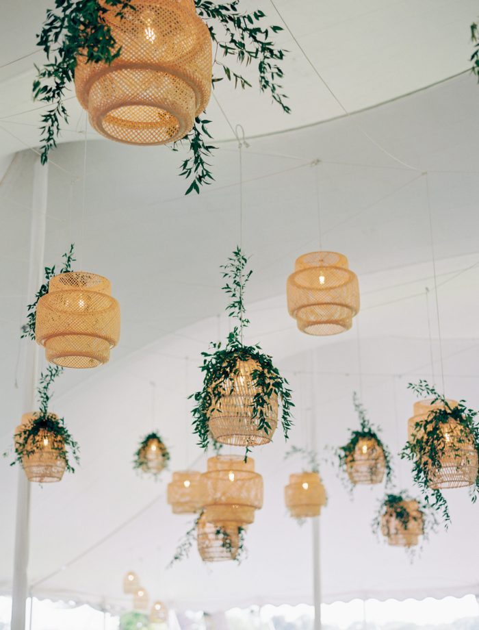 Showing Many Elegant Looking Rattan Lantern With A Touch Of Greenery